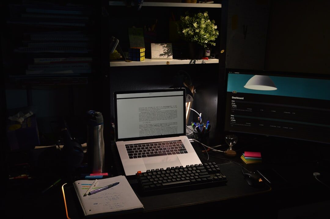 Cozy study room with wooden desk, books and warm lamp light